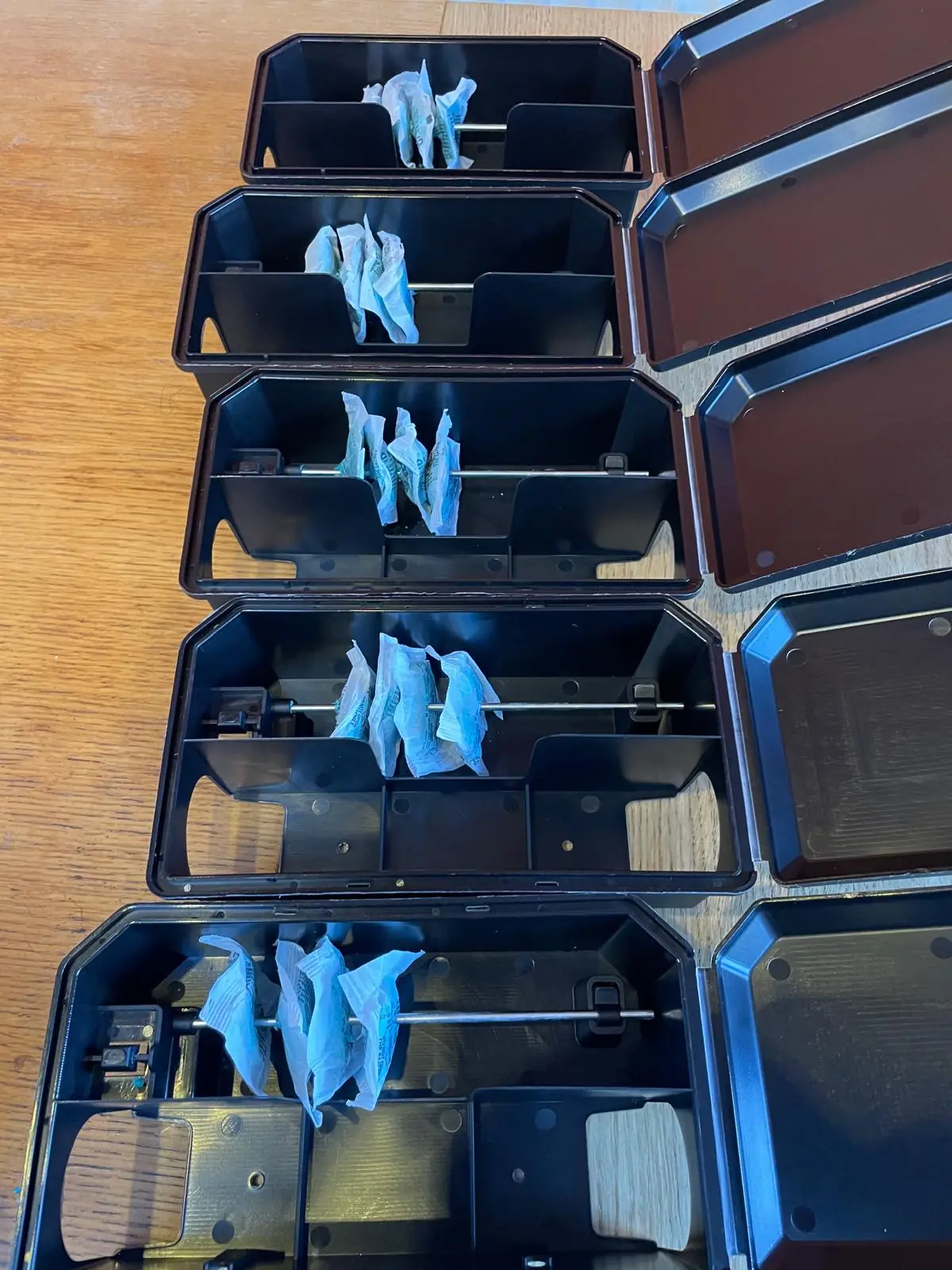 Professional rodent bait blocks loaded into tamper-resistant bait stations for commercial rat treatment