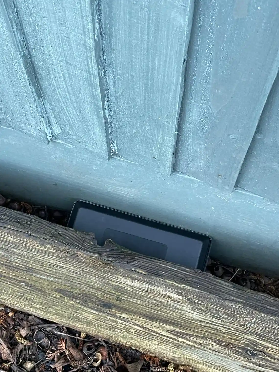 Tamper-resistant rodent bait station installed for safe mouse control