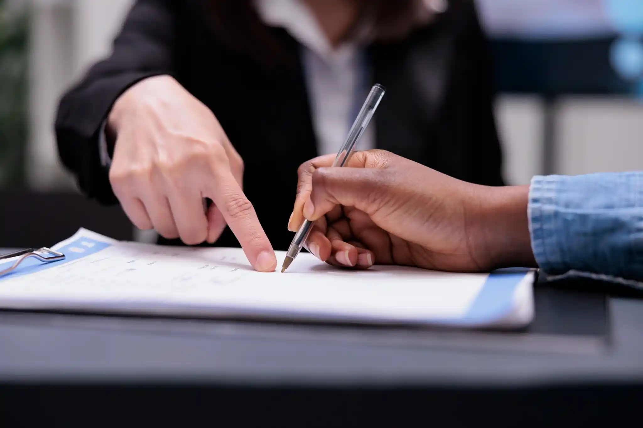 Business owner signing a commercial pest control service agreement for mice management Business owner signing a commercial pest control service agreement for mice management